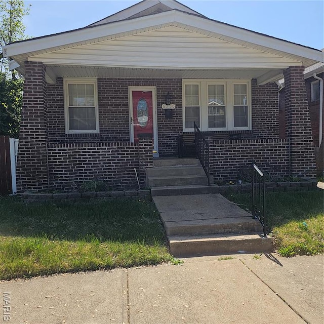 6336 Laura Ave, Saint Louis, MO 63136 - bungalow featuring brick siding and covered porch