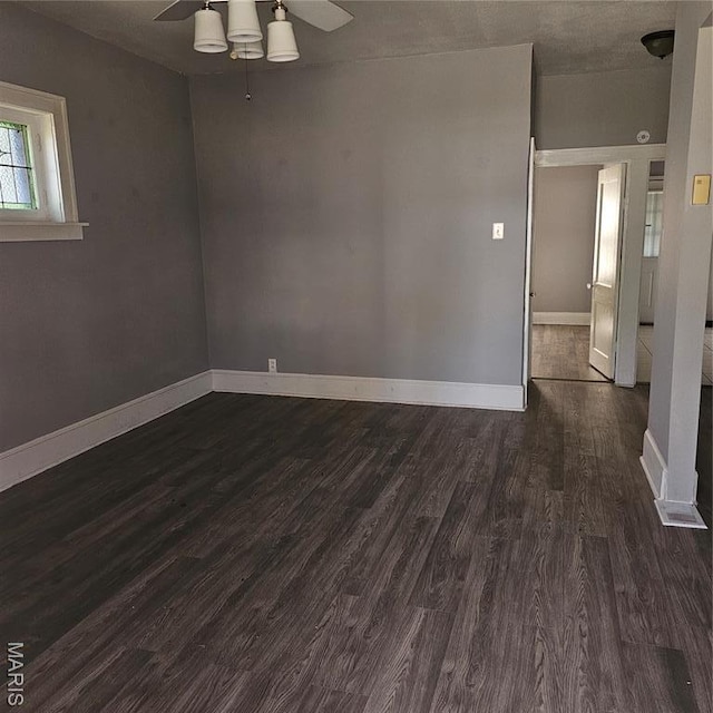 6336 Laura Ave, Saint Louis, MO 63136 - spare room featuring a ceiling fan, baseboards, and dark wood-style floors