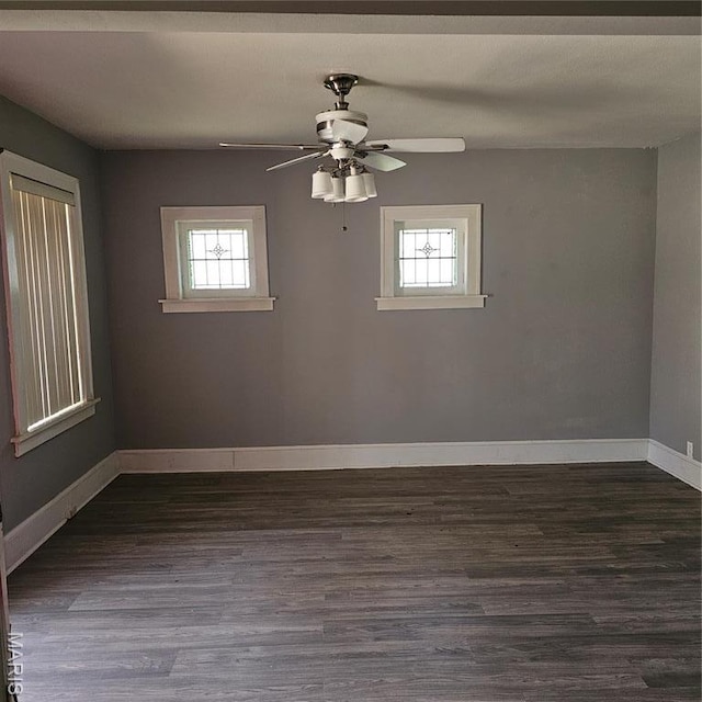 6336 Laura Ave, Saint Louis, MO 63136 - spare room with healthy amount of natural light, dark wood-type flooring, and a ceiling fan