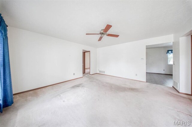 1407 Ramsey Place Rd, Rolla, MO 65401 - spare room with carpet floors, ceiling fan, and baseboards