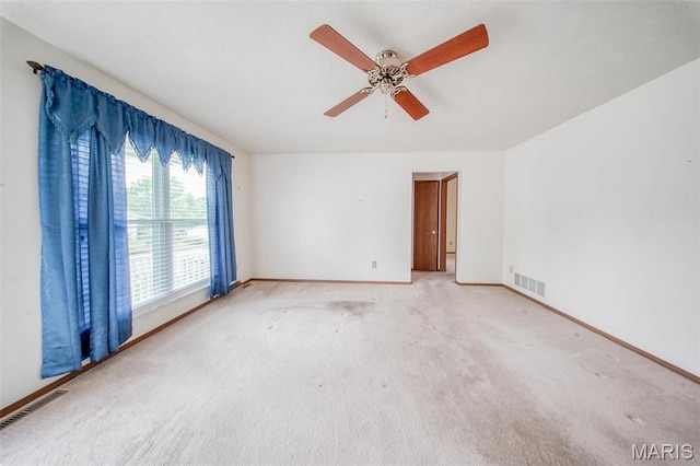 1407 Ramsey Place Rd, Rolla, MO 65401 - empty room featuring baseboards, light colored carpet, and ceiling fan