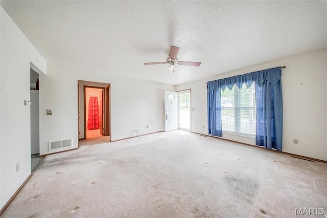 1407 Ramsey Place Rd, Rolla, MO 65401 - carpeted spare room with ceiling fan, baseboards, and a textured ceiling