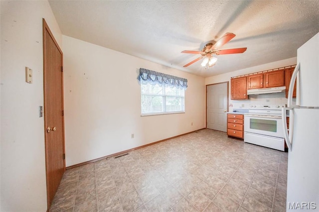 1407 Ramsey Place Rd, Rolla, MO 65401 - kitchen featuring white appliances, under cabinet range hood, brown cabinetry, ceiling fan, and a textured ceiling
