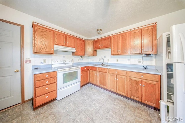 1407 Ramsey Place Rd, Rolla, MO 65401 - kitchen with white electric range, a sink, under cabinet range hood, light countertops, and a textured ceiling