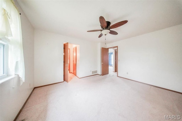 1407 Ramsey Place Rd, Rolla, MO 65401 - unfurnished room featuring ceiling fan, light colored carpet, and baseboards