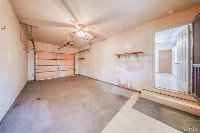 1407 Ramsey Place Rd, Rolla, MO 65401 - garage with a garage door opener and a ceiling fan
