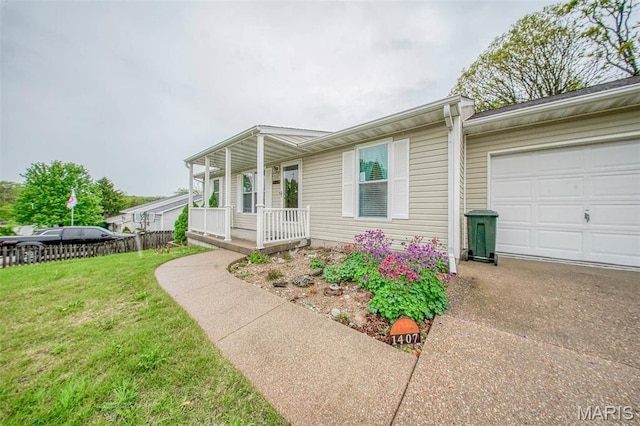 1407 Ramsey Place Rd, Rolla, MO 65401 - view of front facade with a porch, a front yard, concrete driveway, and an attached garage