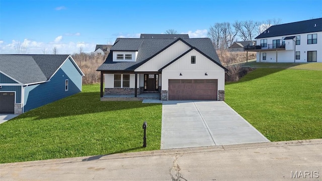 908 Half Moon Ln, Caseyville, IL 62232 - modern farmhouse style home featuring driveway, a front yard, stone siding, and an attached garage