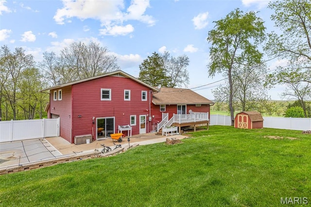 10179 Cherry Hill Ln, Potosi, MO 63664 - rear view of property featuring a patio, a wooden deck, a storage unit, and an outdoor structure