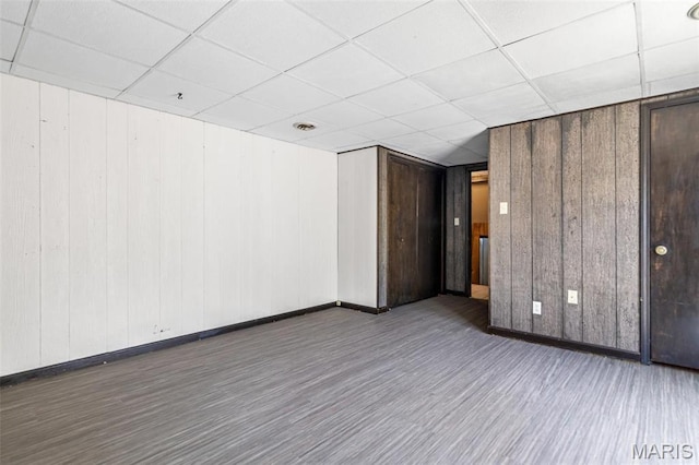 10179 Cherry Hill Ln, Potosi, MO 63664 - unfurnished room featuring wood finished floors, baseboards, a paneled ceiling, and wooden walls