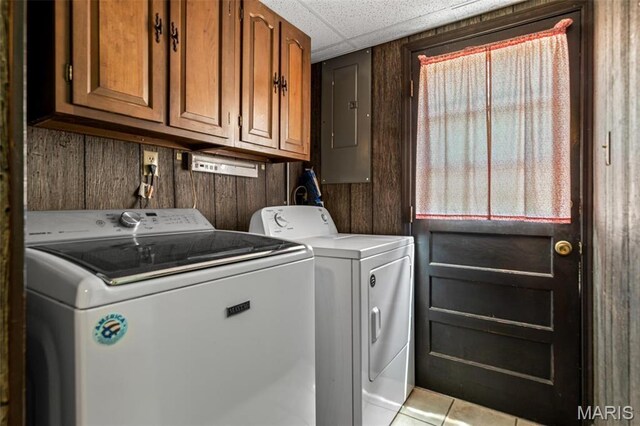 10179 Cherry Hill Ln, Potosi, MO 63664 - clothes washing area with washer and clothes dryer, electric panel, cabinet space, and tile patterned floors