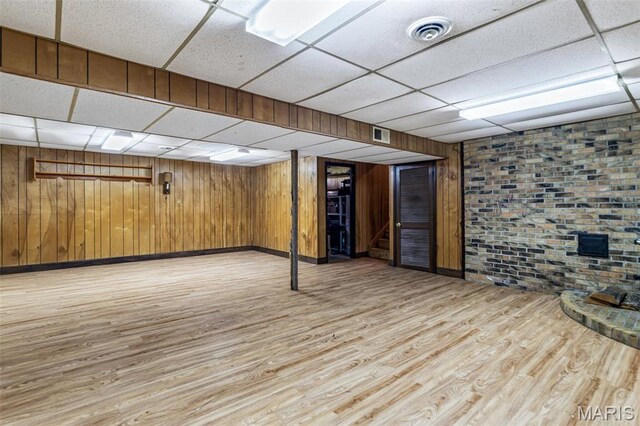 10179 Cherry Hill Ln, Potosi, MO 63664 - finished below grade area with a paneled ceiling, light wood finished floors, baseboards, and wooden walls