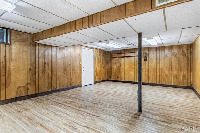10179 Cherry Hill Ln, Potosi, MO 63664 - finished below grade area featuring light wood-type flooring, a paneled ceiling, baseboards, and wood walls