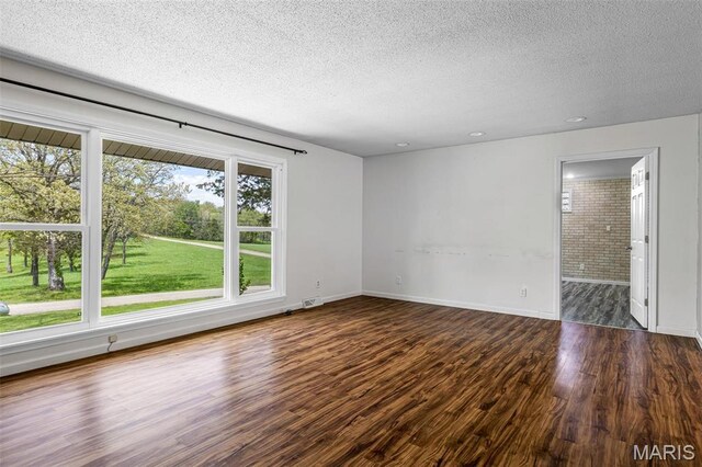 10179 Cherry Hill Ln, Potosi, MO 63664 - unfurnished room with a textured ceiling, wood finished floors, baseboards, and recessed lighting