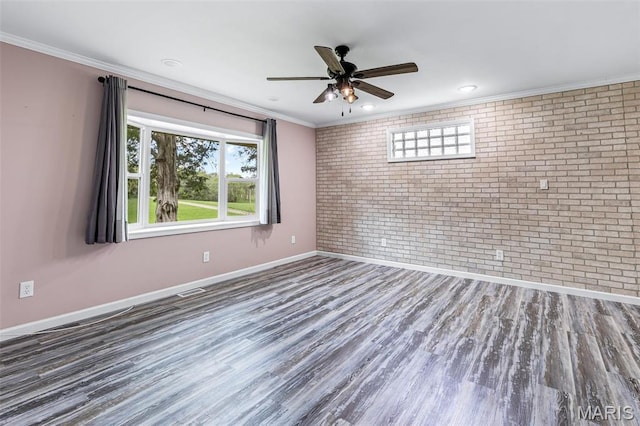 10179 Cherry Hill Ln, Potosi, MO 63664 - spare room with brick wall, baseboards, wood finished floors, ornamental molding, and ceiling fan