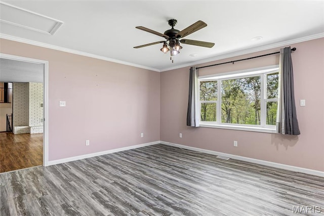 10179 Cherry Hill Ln, Potosi, MO 63664 - spare room featuring ornamental molding, wood finished floors, baseboards, and ceiling fan