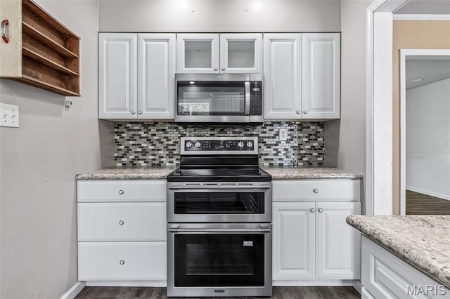 10179 Cherry Hill Ln, Potosi, MO 63664 - kitchen featuring appliances with stainless steel finishes, white cabinetry, backsplash, and dark wood-type flooring