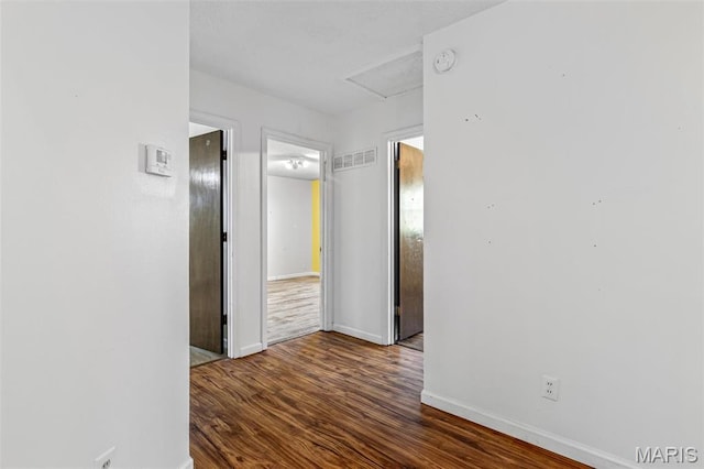 10179 Cherry Hill Ln, Potosi, MO 63664 - hallway featuring wood finished floors, baseboards, and attic access