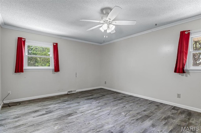 10179 Cherry Hill Ln, Potosi, MO 63664 - unfurnished room with a textured ceiling, healthy amount of natural light, wood finished floors, crown molding, and ceiling fan