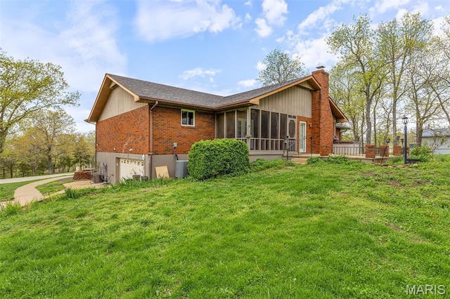 1304 Napoleon Dr, Bonne Terre, MO 63628 - rear view of property with a sunroom, a chimney, an attached garage, a lawn, and brick siding