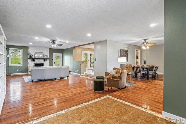 1304 Napoleon Dr, Bonne Terre, MO 63628 - living area with a ceiling fan, baseboards, a textured ceiling, plenty of natural light, and recessed lighting