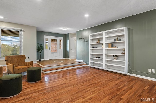 1304 Napoleon Dr, Bonne Terre, MO 63628 - living area with wood finished floors, baseboards, and a textured ceiling