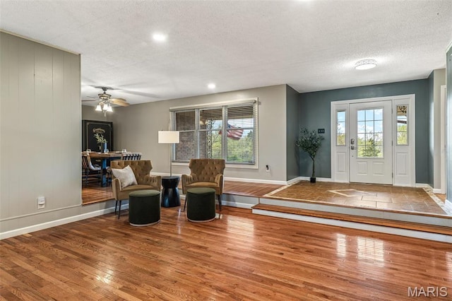 1304 Napoleon Dr, Bonne Terre, MO 63628 - foyer with baseboards, wood finished floors, ceiling fan, a textured ceiling, and recessed lighting