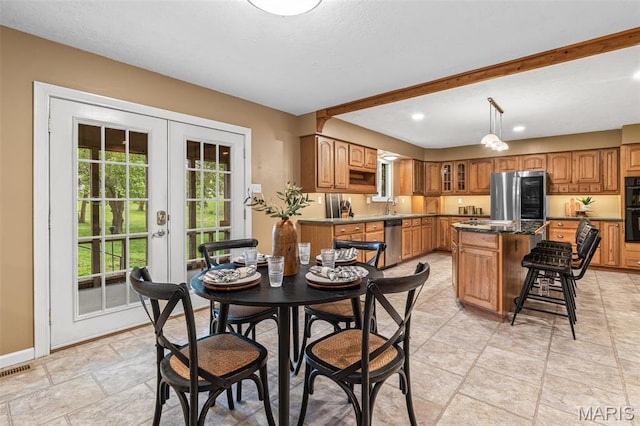 1304 Napoleon Dr, Bonne Terre, MO 63628 - dining space featuring french doors, light stone finish flooring, baseboards, and recessed lighting