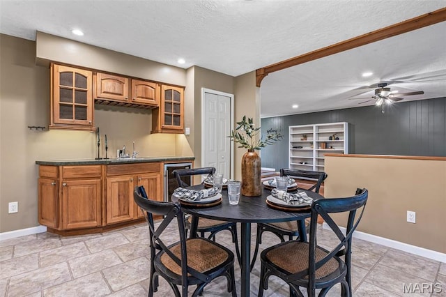 1304 Napoleon Dr, Bonne Terre, MO 63628 - dining area featuring wet bar, baseboards, ceiling fan, recessed lighting, and a textured ceiling
