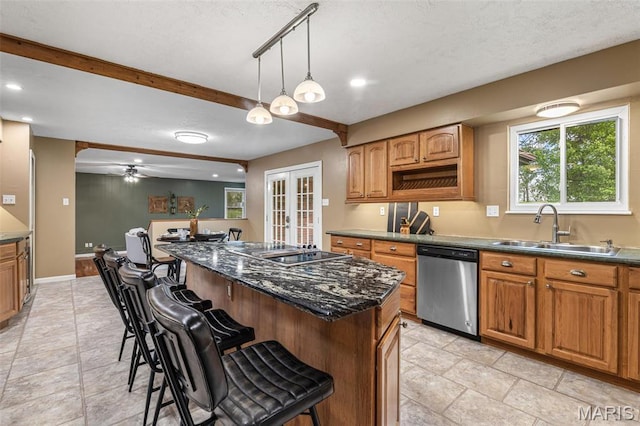 1304 Napoleon Dr, Bonne Terre, MO 63628 - kitchen featuring stainless steel dishwasher, a sink, a kitchen breakfast bar, black electric stovetop, and french doors