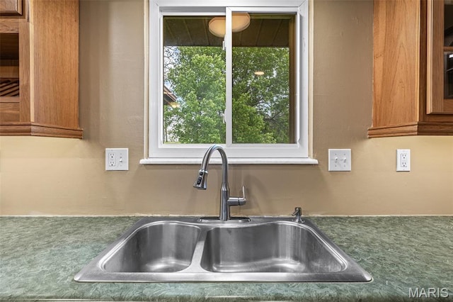 1304 Napoleon Dr, Bonne Terre, MO 63628 - kitchen view of a sink and brown cabinetry