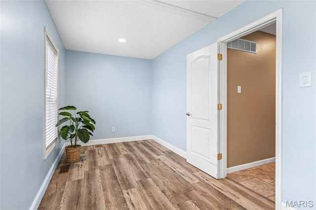 1304 Napoleon Dr, Bonne Terre, MO 63628 - spare room with wood finished floors, baseboards, and recessed lighting