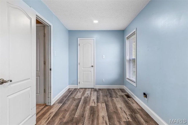1304 Napoleon Dr, Bonne Terre, MO 63628 - hallway with a textured ceiling, wood finished floors, baseboards, and recessed lighting