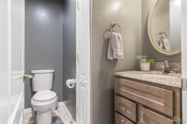 1304 Napoleon Dr, Bonne Terre, MO 63628 - bathroom with toilet, vanity, and baseboards