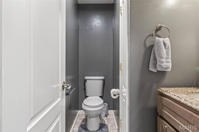 1304 Napoleon Dr, Bonne Terre, MO 63628 - bathroom featuring toilet, vanity, and baseboards