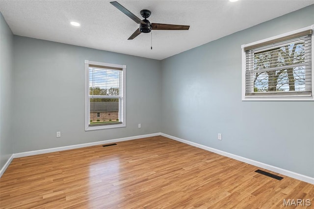 1304 Napoleon Dr, Bonne Terre, MO 63628 - spare room featuring a ceiling fan, light wood finished floors, baseboards, recessed lighting, and a textured ceiling