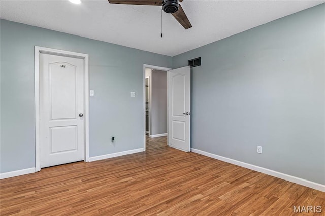 1304 Napoleon Dr, Bonne Terre, MO 63628 - unfurnished bedroom with light wood-style floors, baseboards, and a ceiling fan