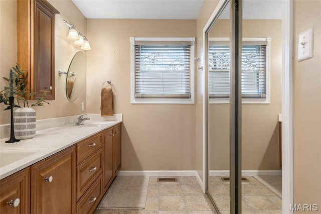1304 Napoleon Dr, Bonne Terre, MO 63628 - full bathroom with baseboards and double vanity