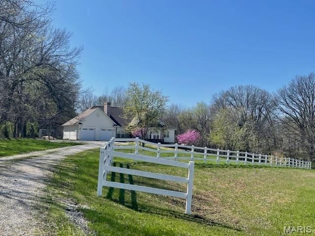11 Summers Dr, Hawk Point, MO 63349 - view of yard with driveway and an attached garage