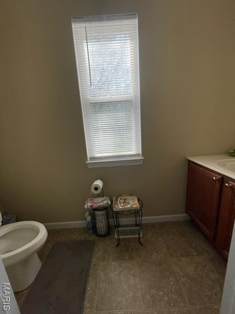 11 Summers Dr, Hawk Point, MO 63349 - bathroom with baseboards, vanity, tile patterned flooring, and toilet