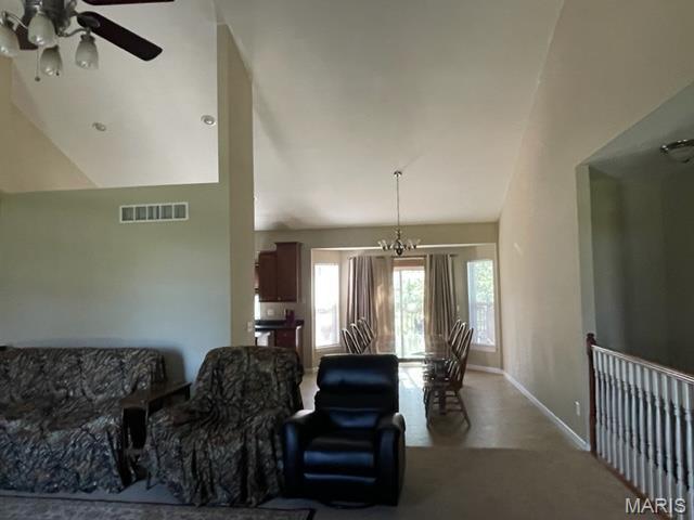 11 Summers Dr, Hawk Point, MO 63349 - living room with vaulted ceiling, a ceiling fan, baseboards, and carpet floors