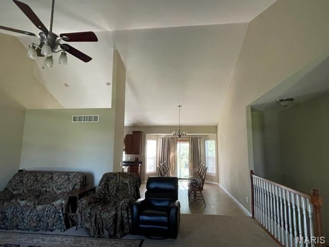 11 Summers Dr, Hawk Point, MO 63349 - living area featuring a ceiling fan, baseboards, and high vaulted ceiling