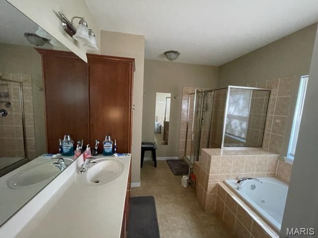 11 Summers Dr, Hawk Point, MO 63349 - bathroom with a shower stall, a garden tub, tile patterned floors, and vanity