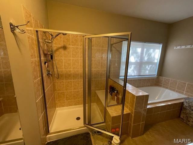 11 Summers Dr, Hawk Point, MO 63349 - bathroom featuring a bath, a shower stall, and tile patterned flooring