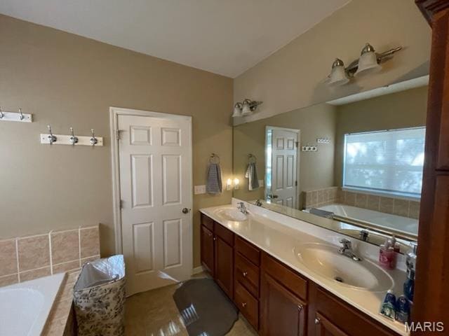 11 Summers Dr, Hawk Point, MO 63349 - full bathroom featuring a garden tub, double vanity, and tile patterned floors