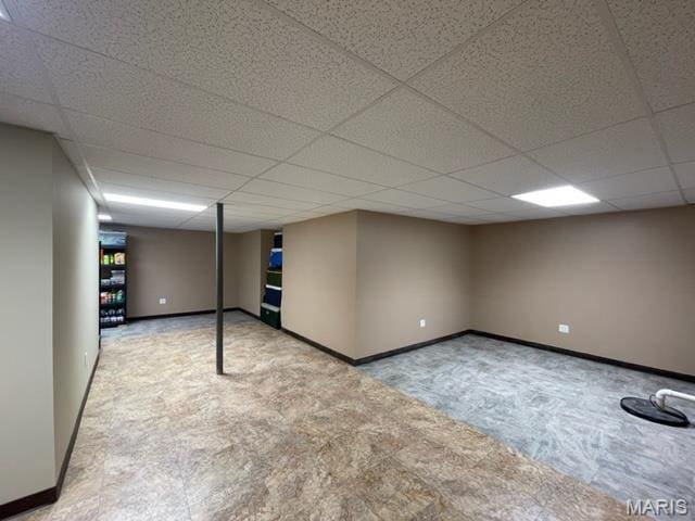 11 Summers Dr, Hawk Point, MO 63349 - finished below grade area with a paneled ceiling, carpet flooring, and baseboards
