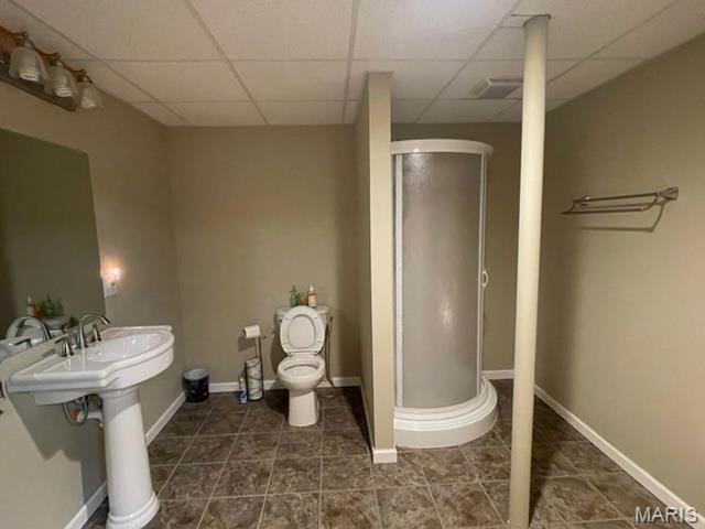 11 Summers Dr, Hawk Point, MO 63349 - full bathroom featuring a drop ceiling, a stall shower, toilet, tile patterned flooring, and baseboards