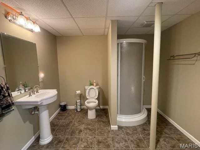 11 Summers Dr, Hawk Point, MO 63349 - bathroom with a stall shower, a drop ceiling, toilet, tile patterned floors, and baseboards