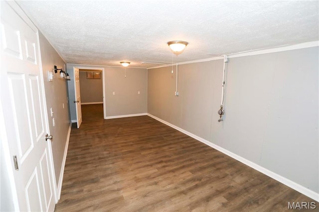 6616 Dunwold Dr, Saint Louis, MO 63134 - basement with a textured ceiling, wood finished floors, and baseboards