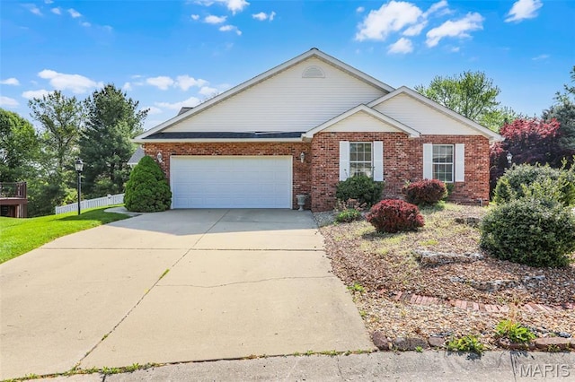 14 Berry Patch Ln, Glen Carbon, IL 62034 - view of front of property featuring brick siding, concrete driveway, an attached garage, and fence